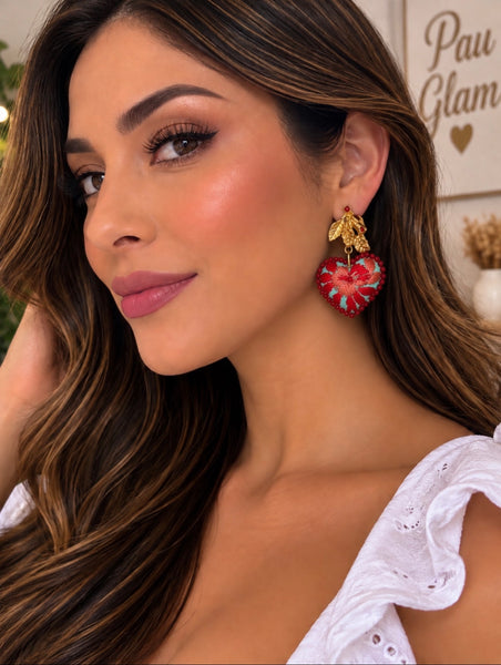 Hand-embroidered turquoise heart earrings with colorful floral and beaded details. Unique artisan statement earrings by PauGlam.
